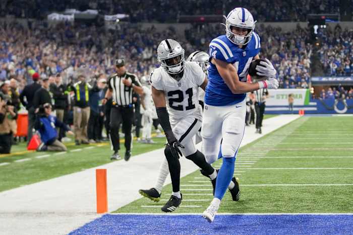 Indianapolis Colts wide receiver Alec Pierce (14) runs into the end zone for a touchdown as Las Vegas Raiders cornerback Amik Robertson (21) gives chase Sunday, Dec. 31, 2023, during a game against the Las Vegas Raiders at Lucas Oil Stadium in Indianapolis.